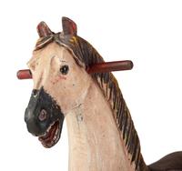 A Carved and Painted Wooden Rocking Horse