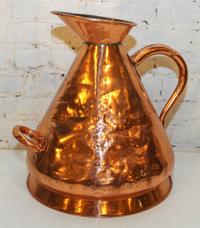 A Copper Jug. Height 18 inches.