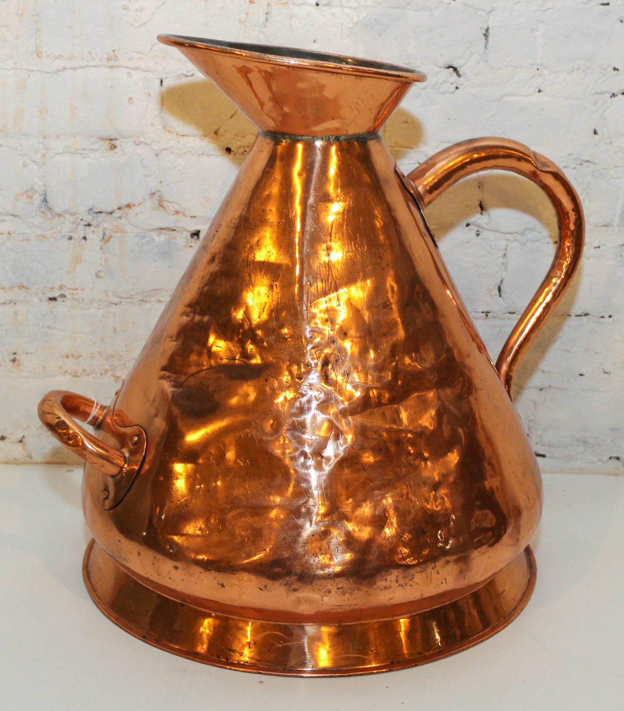 A Copper Jug. Height 18 inches.