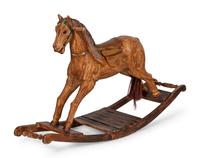 A Paint Decorated Rocking Horse and a Carved Rocking Horse