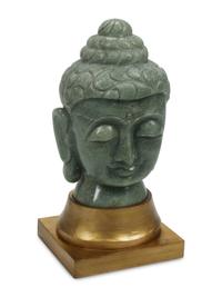 A Carved Green Jasper Head of Buddha
