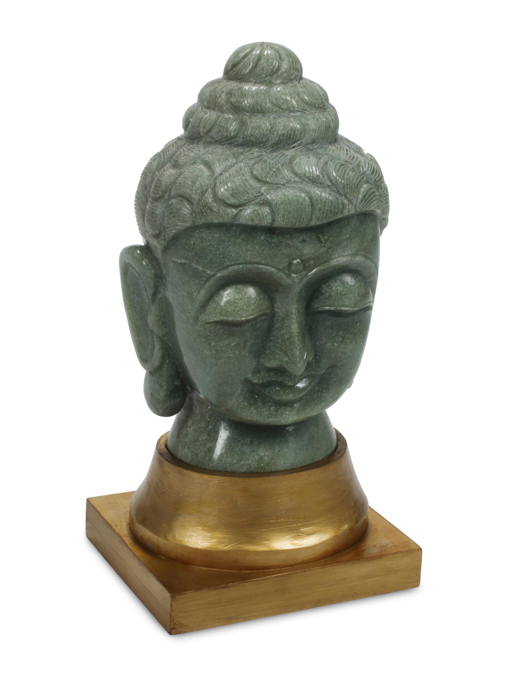 A Carved Green Jasper Head of Buddha