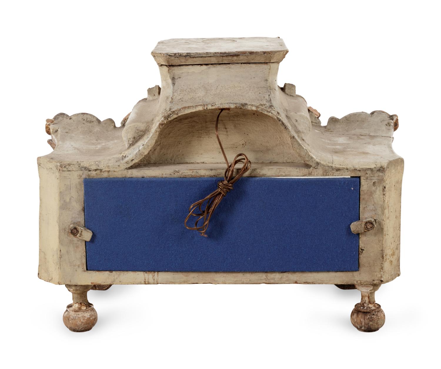 An Italian Painted and Parcel Gilt Reliquary and a Giltwood Mask Ornament