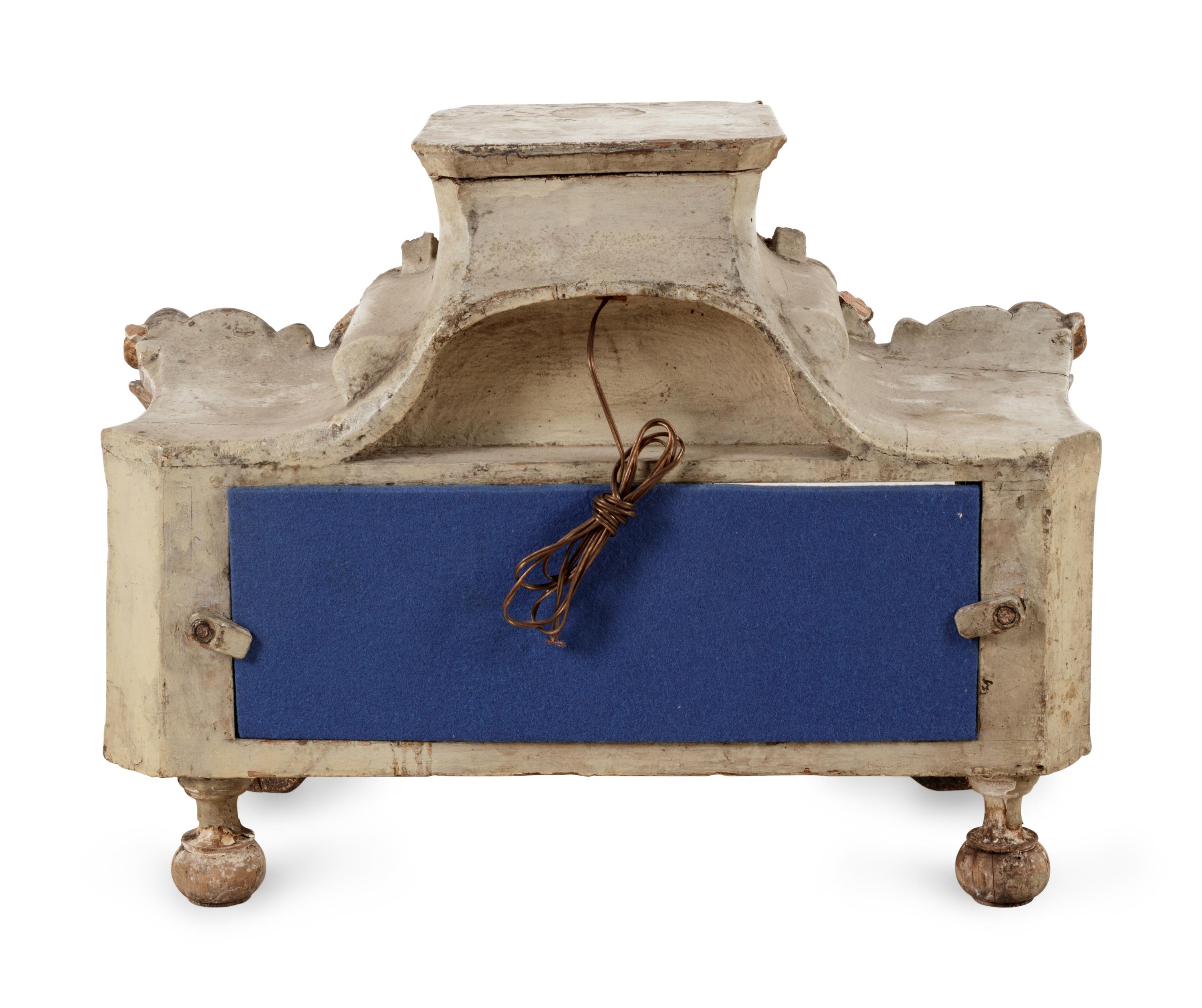 An Italian Painted and Parcel Gilt Reliquary and a Giltwood Mask Ornament