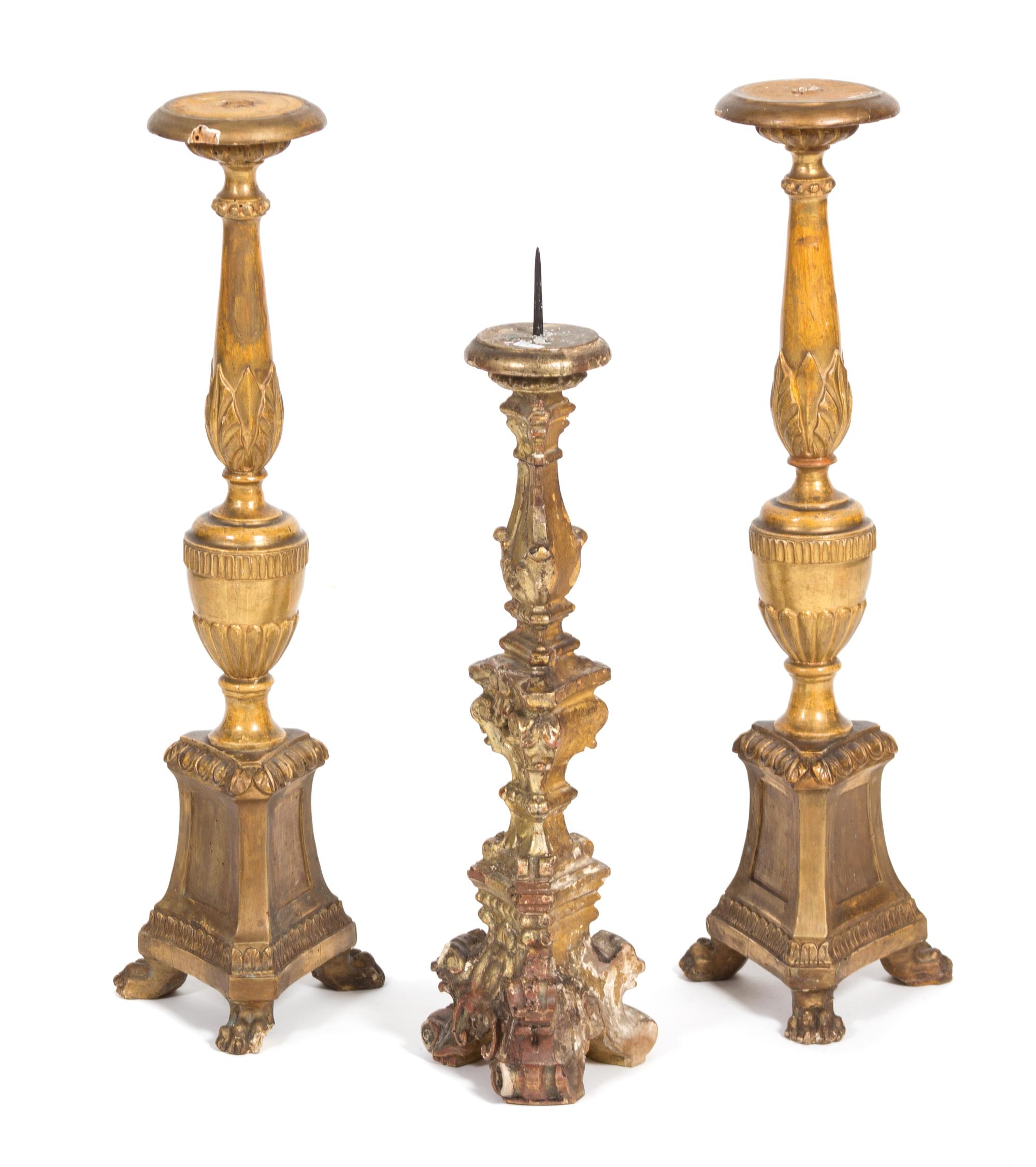 A Group of Three Italian Rococo Style Carved Giltwood Pricket Candlesticks Height of taller 22 1/2 inches. — 19TH CENTURY