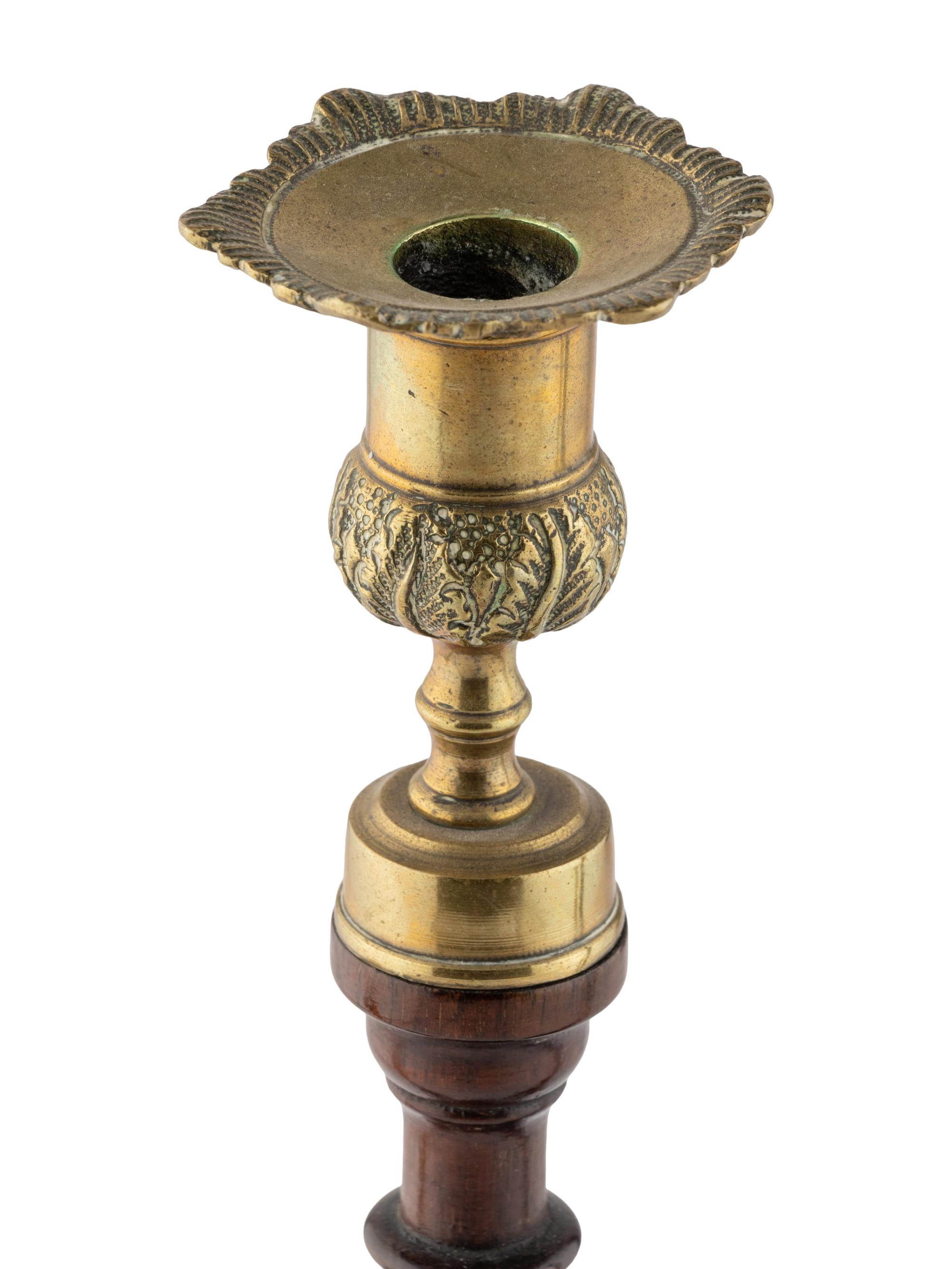A Group of Four English Mahogany and Brass Mounted Candlesticks