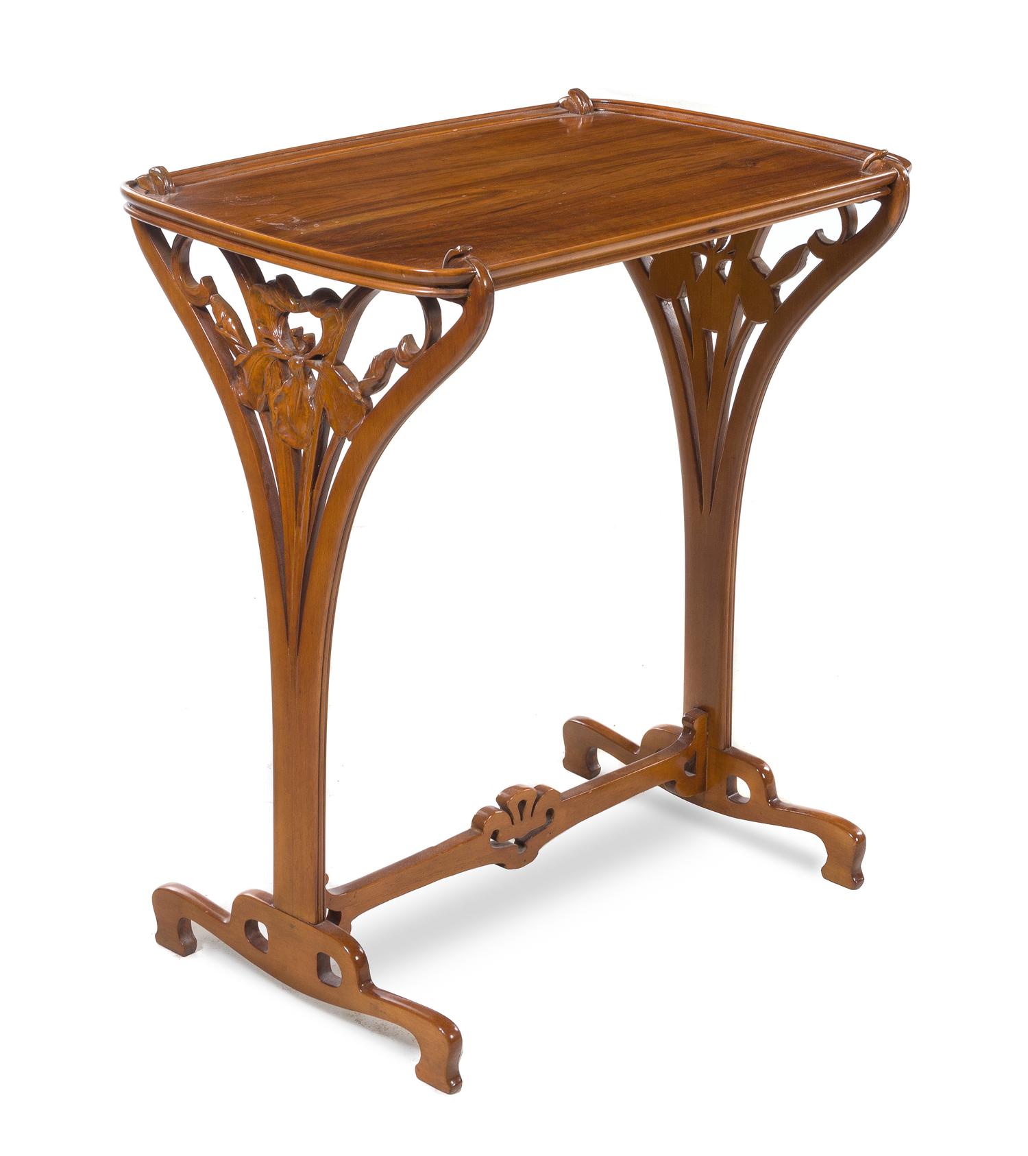 French, FIRST HALF 20TH CENTURY, an Art Nouveau style carved mahogany occasional table