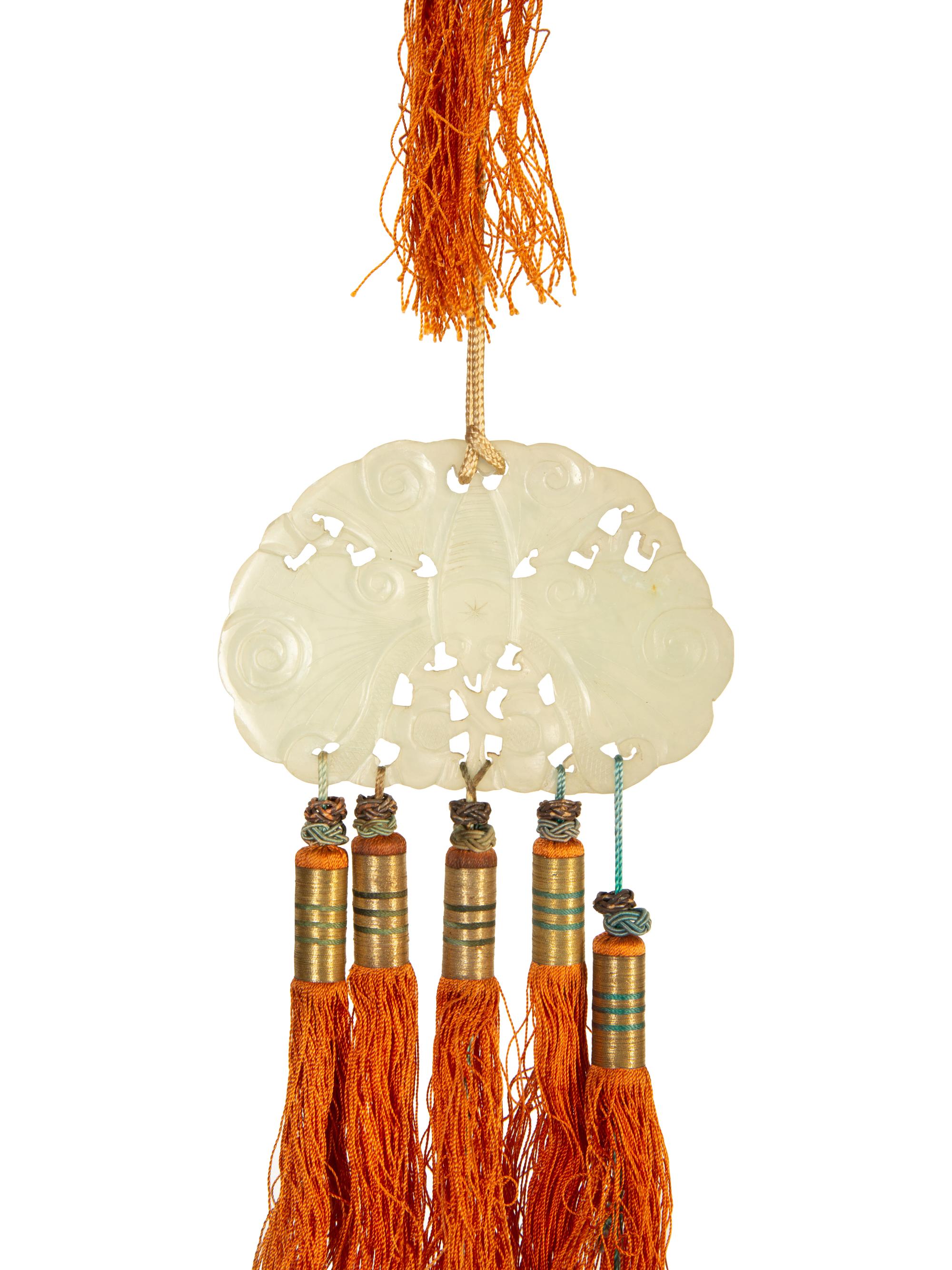 A Pair of Carved Jade Medallion and Tasseled Wall Hangings