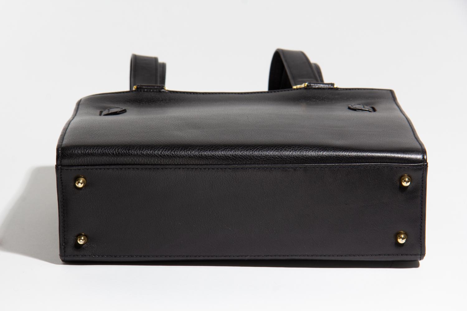A Gianni Versace Black Leather Shoulder Bag, 11" x 8.25" x 3.5"; Strap drop: 21".