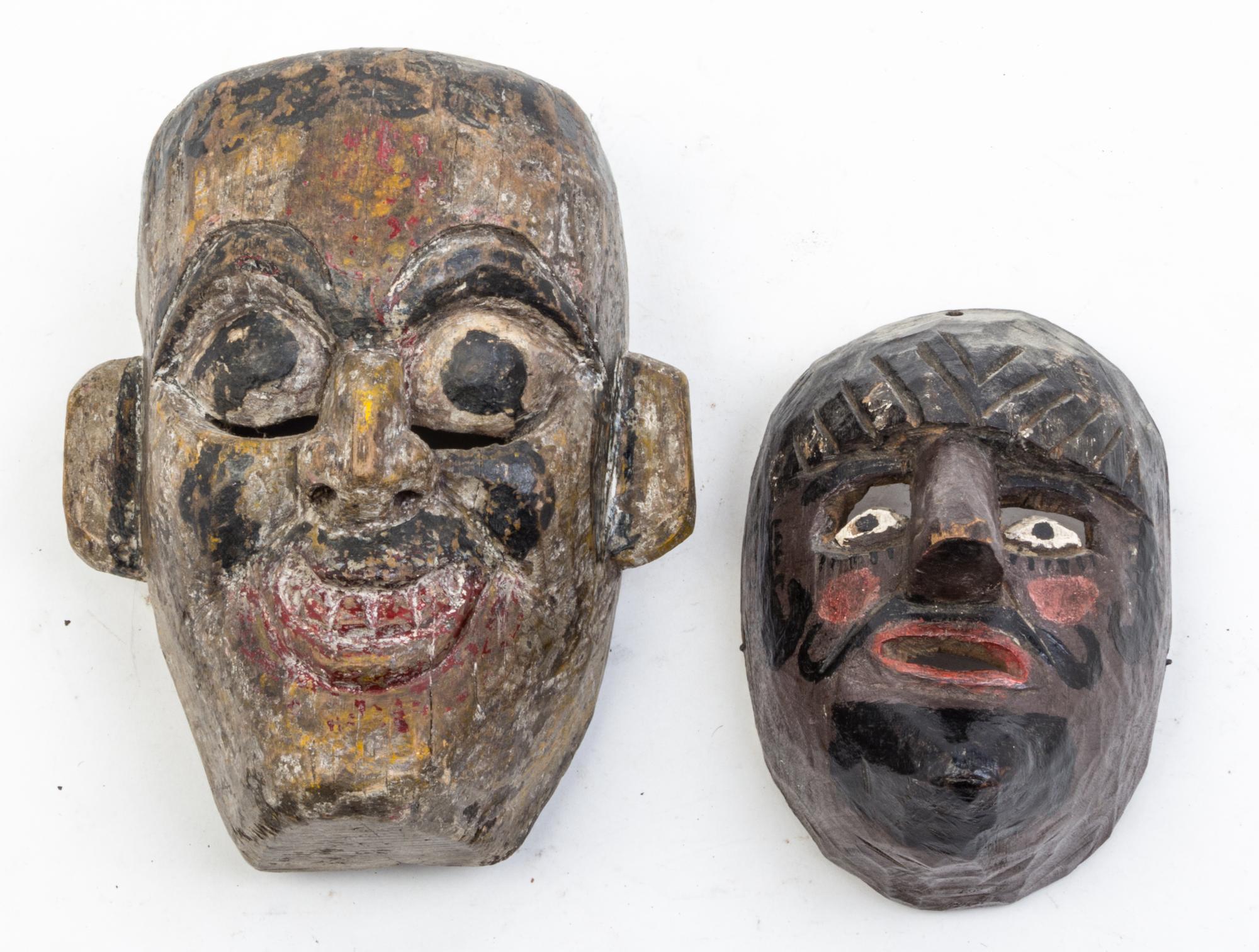 Five Mexican Painted Masks Height of largest 25 inches.
