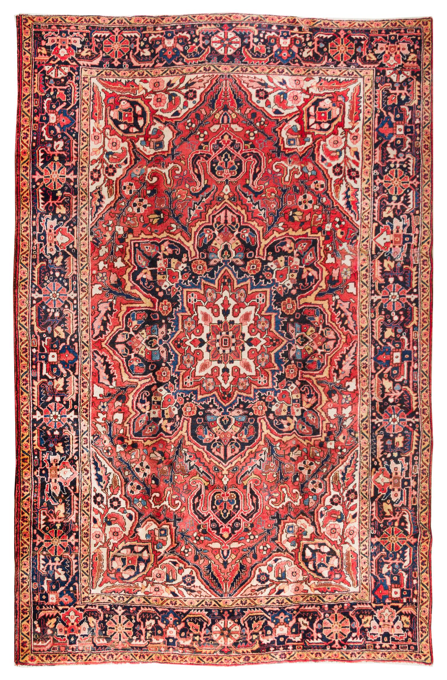 A Heriz Wool Rug 11 feet 6 inches x 8 feet 7 inches. — CIRCA 1930
