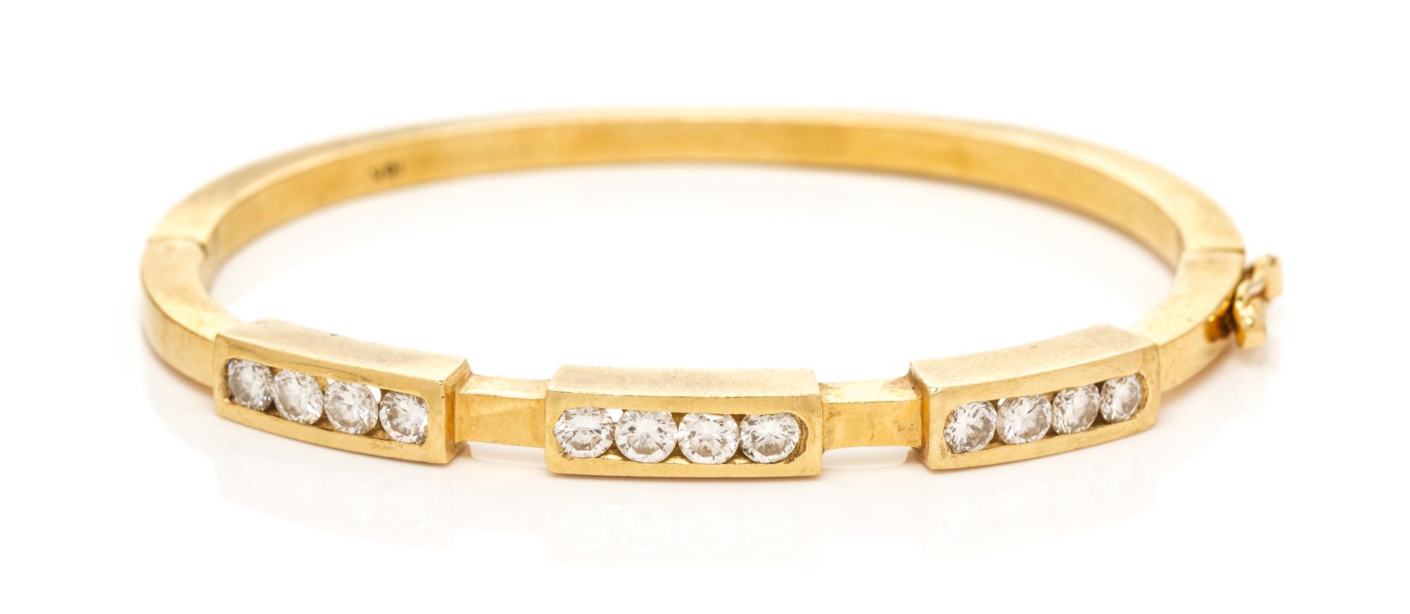 An 18 Karat Yellow Gold and Diamond Bangle Bracelet, 17.60 dwts.