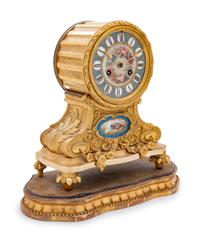 A Louis XVI Style Gilt Bronze and Sèvres Style Porcelain Inset Mantel Clock