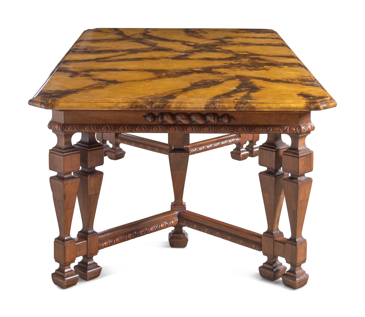 A Renaissance Revival Style Carved Walnut Faux Marble-Top Dining Table