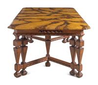 A Renaissance Revival Style Carved Walnut Faux Marble-Top Dining Table