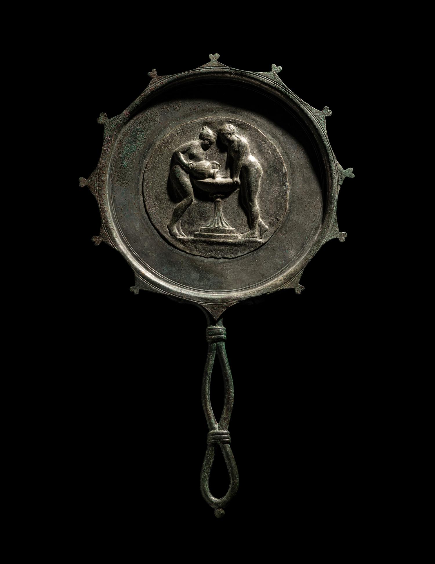 A Roman Bronze and Silver Mirror with Two Women