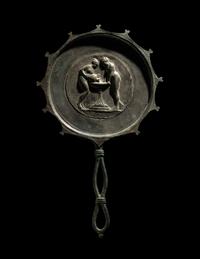 A Roman Bronze and Silver Mirror with Two Women