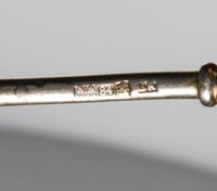 A Russian Silver-Gilt and Enamel Spoon, Maker's mark obscured, assay mark of Anatoly Artsybashev, Moscow, 19th century, the top and und