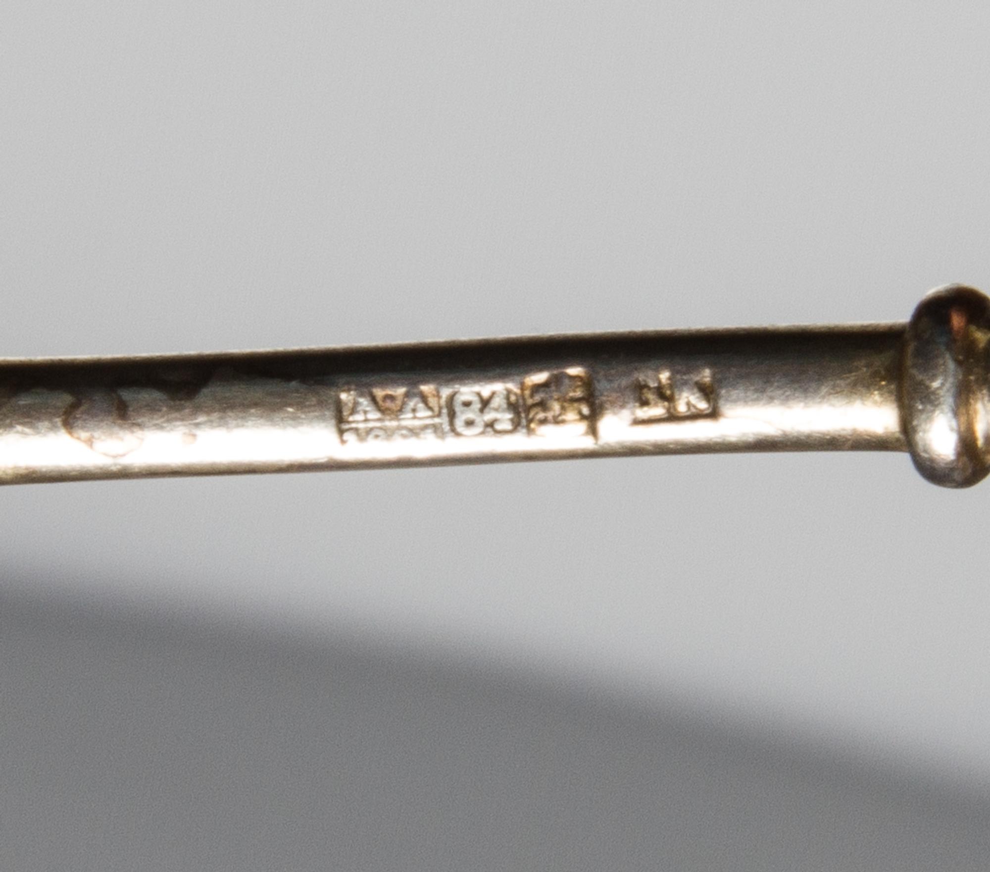 A Russian Silver-Gilt and Enamel Spoon, Maker's mark obscured, assay mark of Anatoly Artsybashev, Moscow, 19th century, the top and und