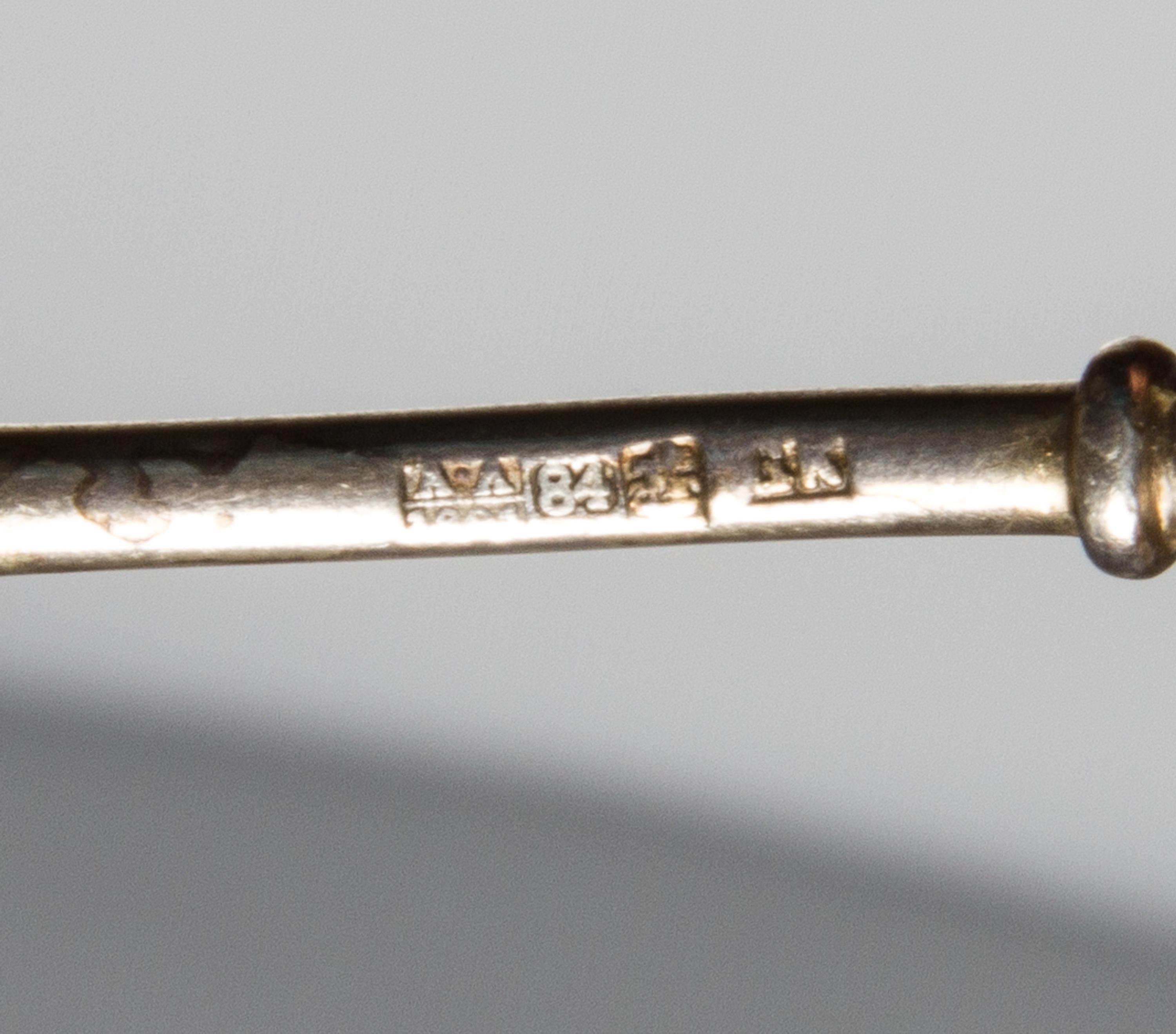 A Russian Silver-Gilt and Enamel Spoon, Maker's mark obscured, assay mark of Anatoly Artsybashev, Moscow, 19th century, the top and und
