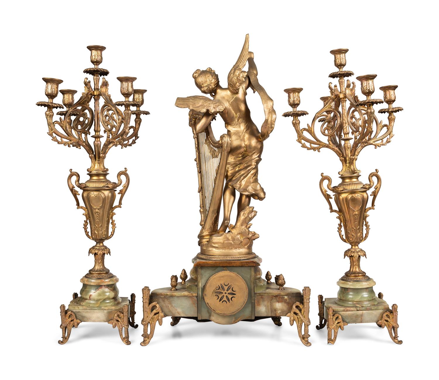 A Neoclassical Gilt Metal and Onyx Clock Garniture