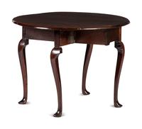 A Queen Anne Carved and Figured Mahogany Drop-Leaf Slipper Foot Table