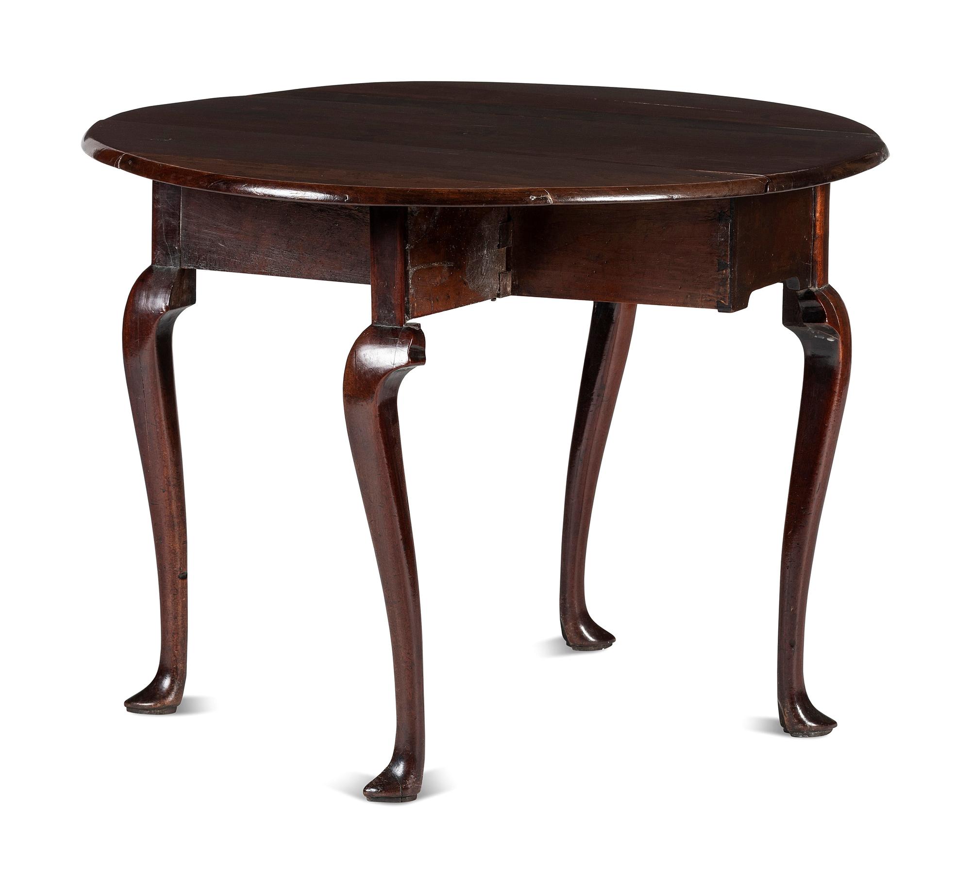 A Queen Anne Carved and Figured Mahogany Drop-Leaf Slipper Foot Table