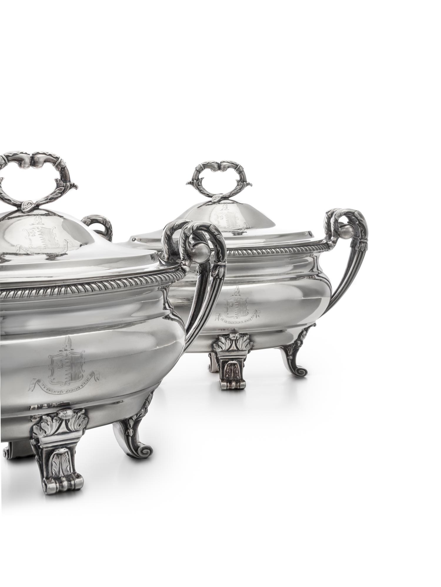 A Pair of George III Silver Sauce Tureens, Paul Storr, London, 1799, each domed lid having an addorsed foliate C-scroll finial and engr