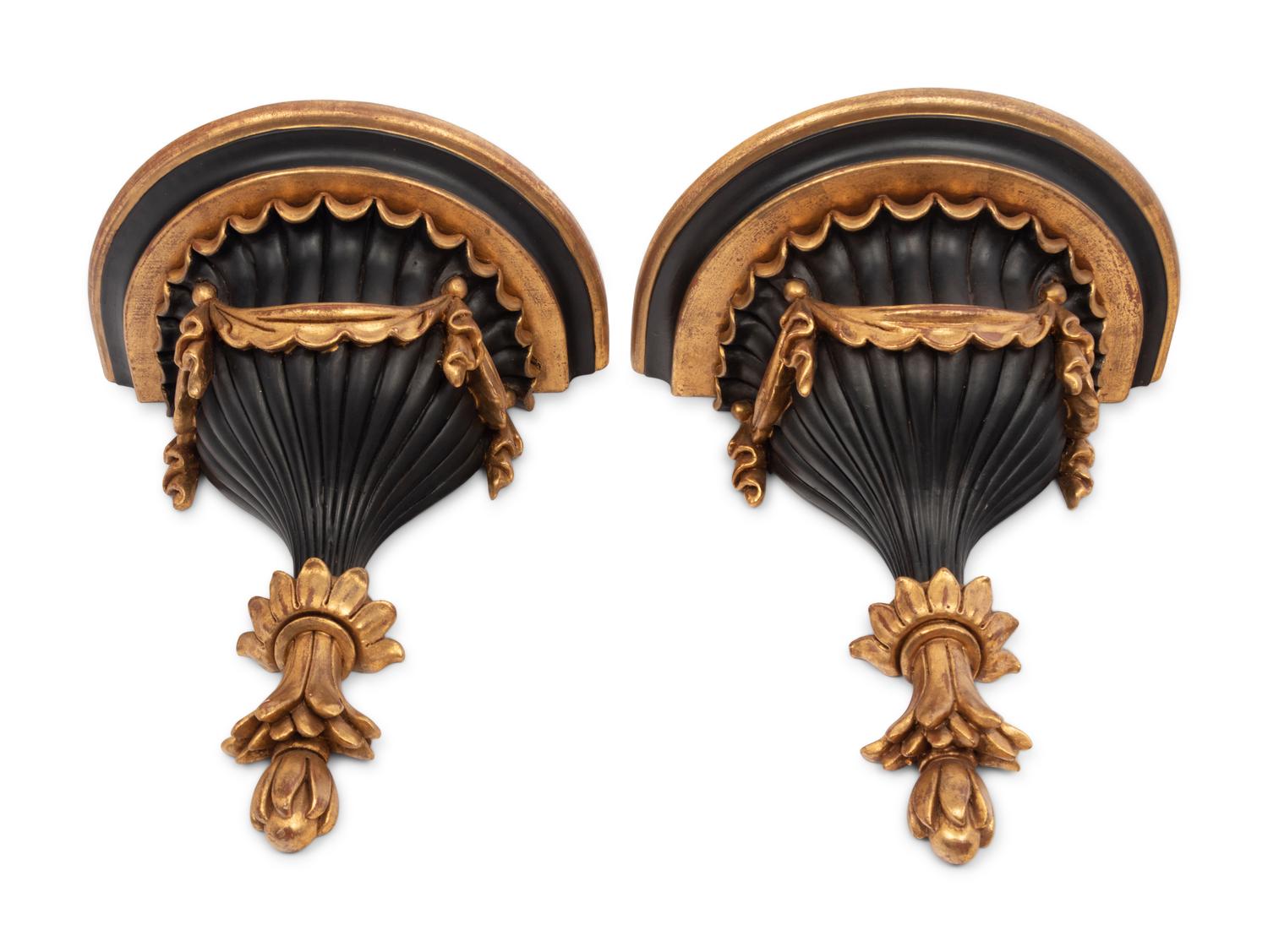 A Pair of Italian Parcel Gilt and Ebonized Wall Brackets
