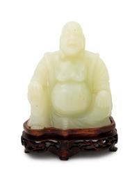 A Chinese Serpentine Figure of a Laughing Buddha