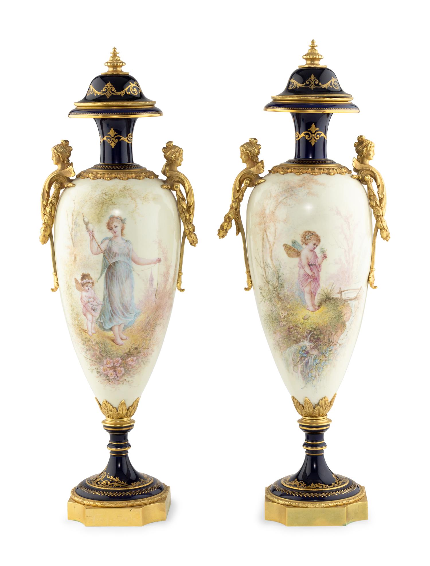 A Pair of Gilt Bronze Mounted Sèvres Style Porcelain Urns