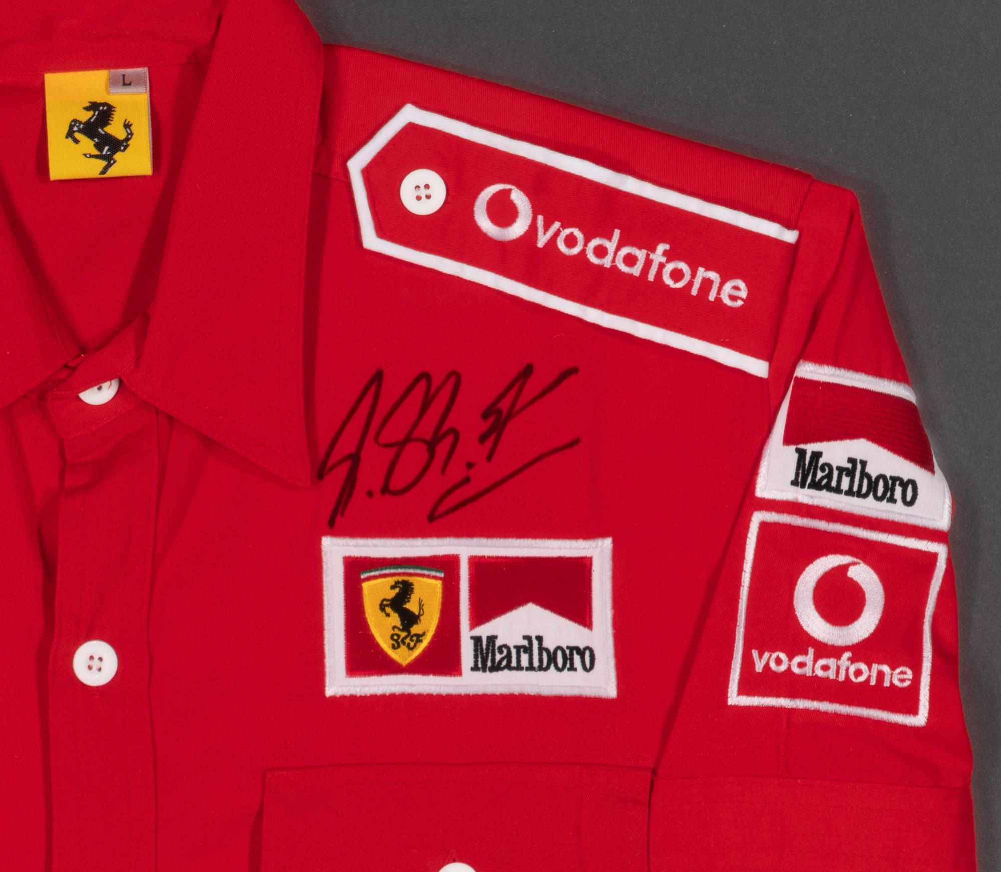 A Michael Schumacher Signed Autograph Ferrari Crew Shirt Display
