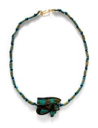 An Egyptian Blue Faience Bead Necklace with a Wadjet