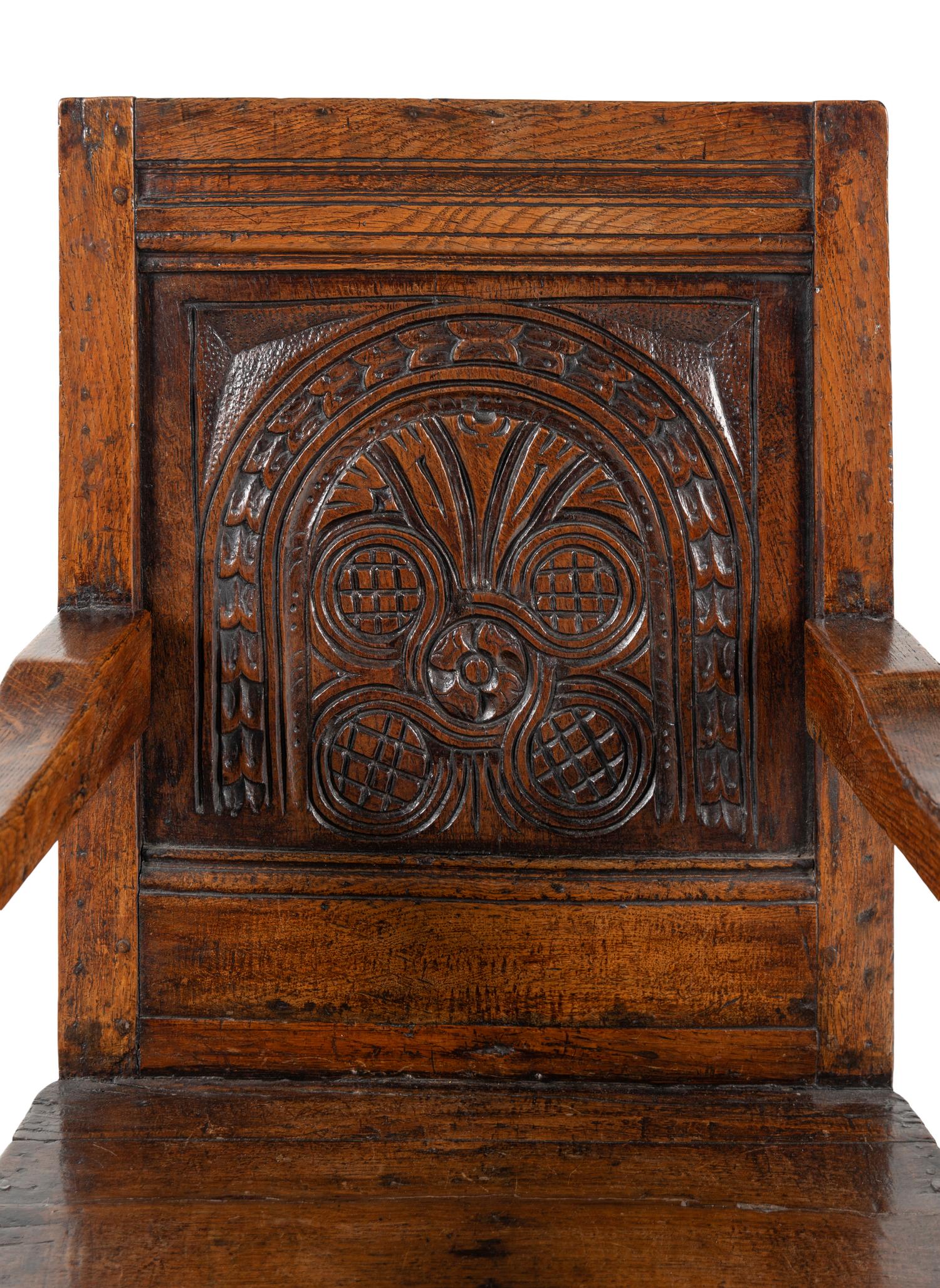 A William and Mary Carved Oak Open Armchair