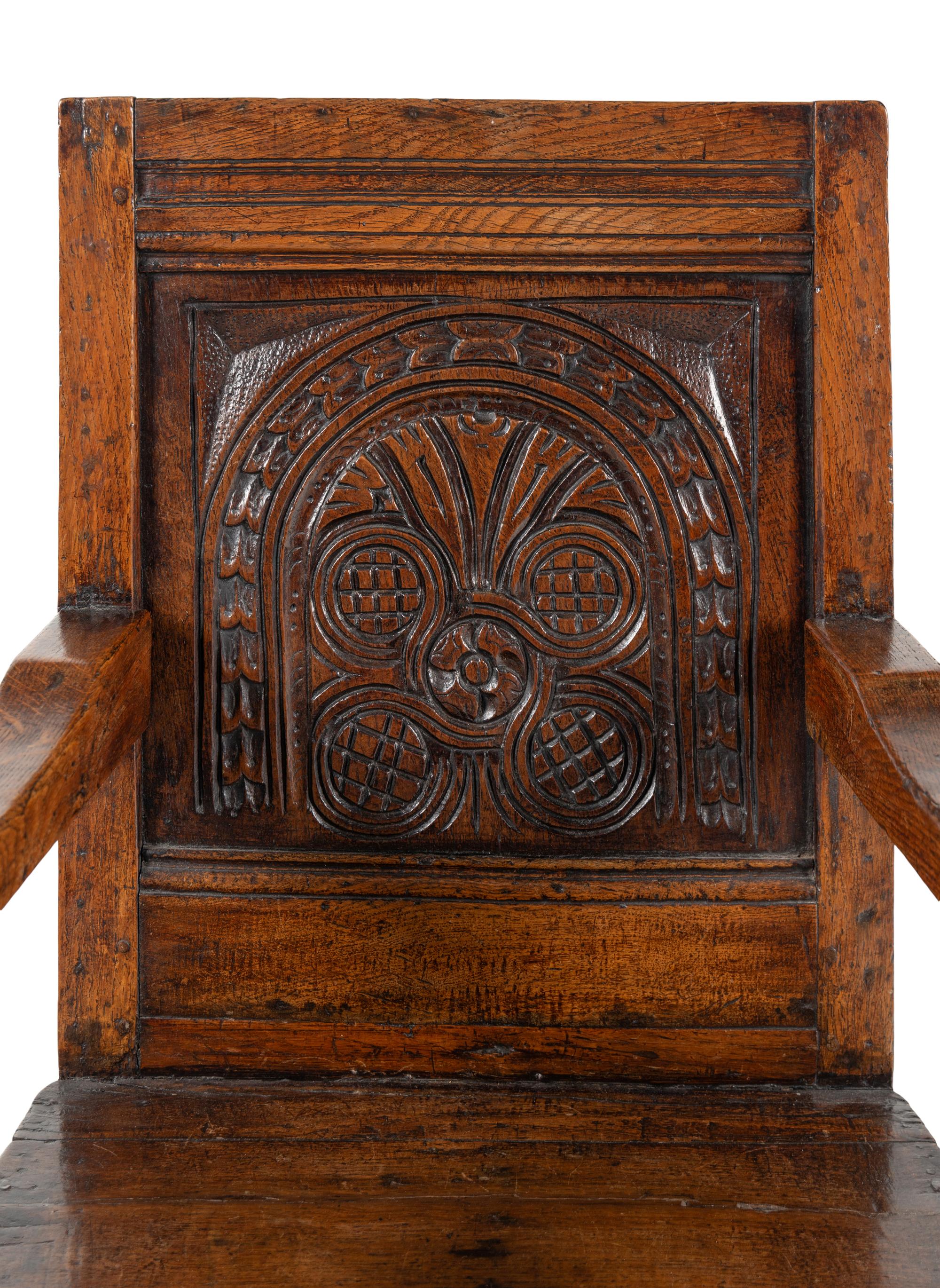 A William and Mary Carved Oak Open Armchair