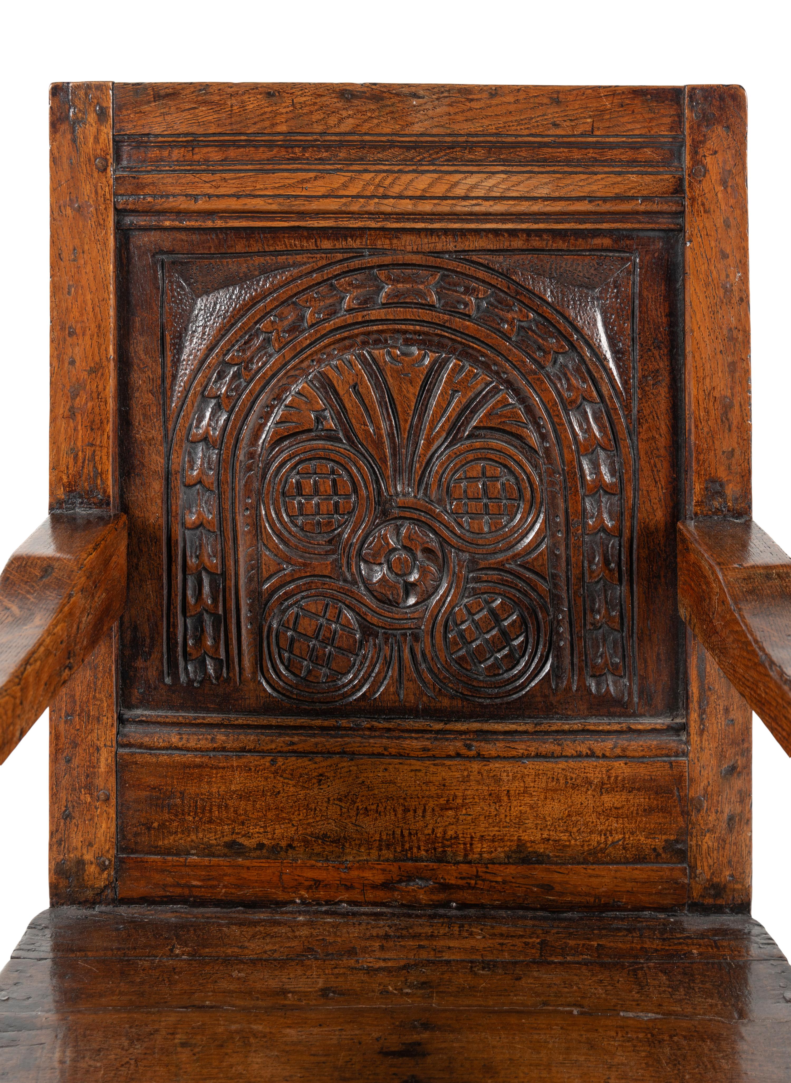 A William and Mary Carved Oak Open Armchair