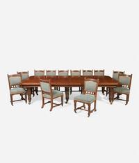 An English Aesthetic Movement carved oak dining table and set of twelve dining chairs Lamb of Manchester, Manchester, England, circa 1875