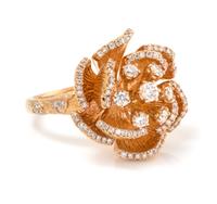 A 14 Karat Rose Gold and Diamond Flower Motif Ring, 9.50 dwts.