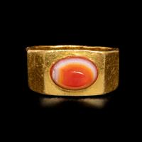 A Roman Gold and Banded Carnelian Cabochon Finger Ring