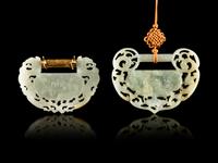 Two Carved Jade Ruyi Lock-Form Pendants