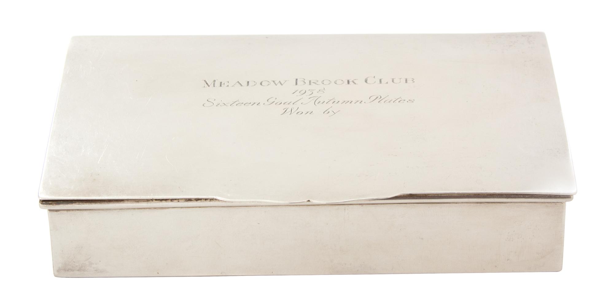 An American Silver Cigarette Box, Retailed by Peter Guile, Ltd., New York, the lid inscribed MEADOW BROOK CLUB/1938/Sixteen Goal Autumn