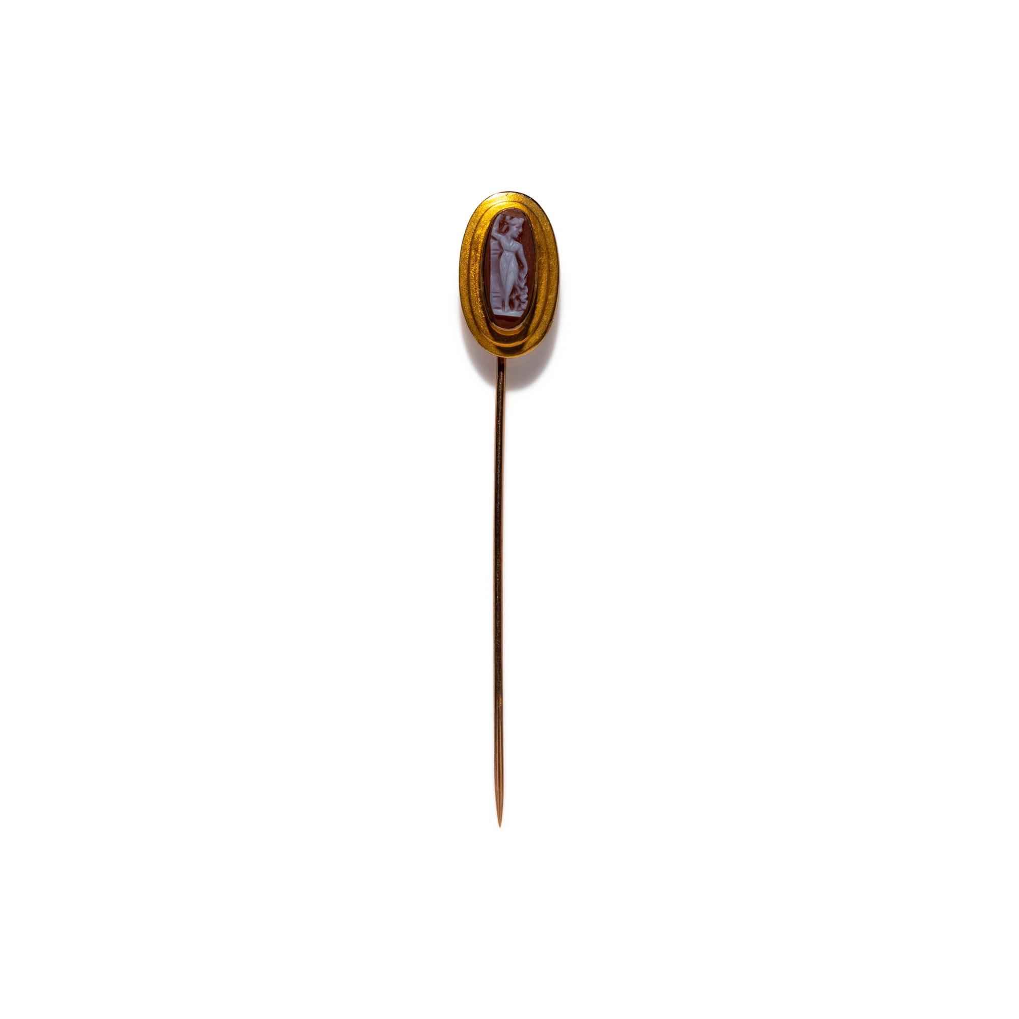 A Neoclassical Gold and Onyx Cameo Stickpin with a Goddess or Muse
