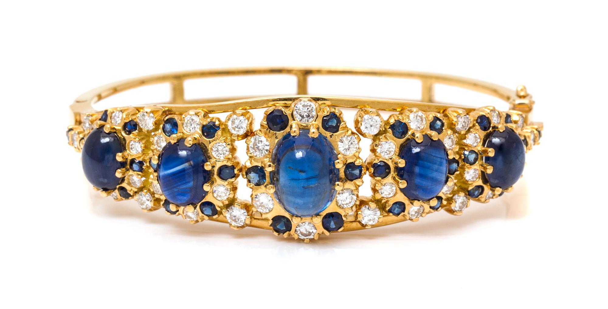 A Yellow Gold, Sapphire and Diamond Bangle Bracelet, 25.90 dwts.