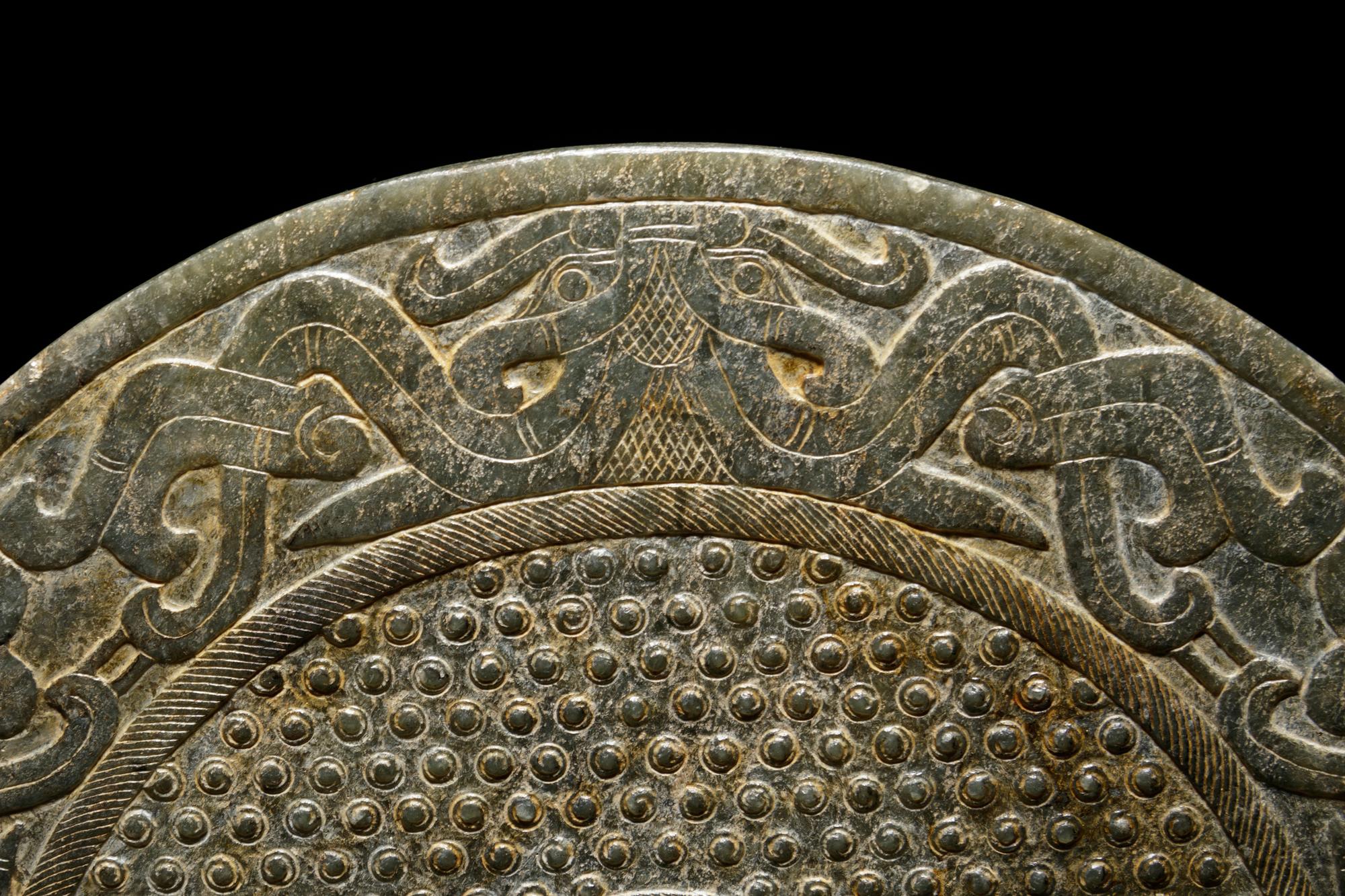 A Chinese Liangzhu-s tyle Carved Nephrite Jade Bi Disc