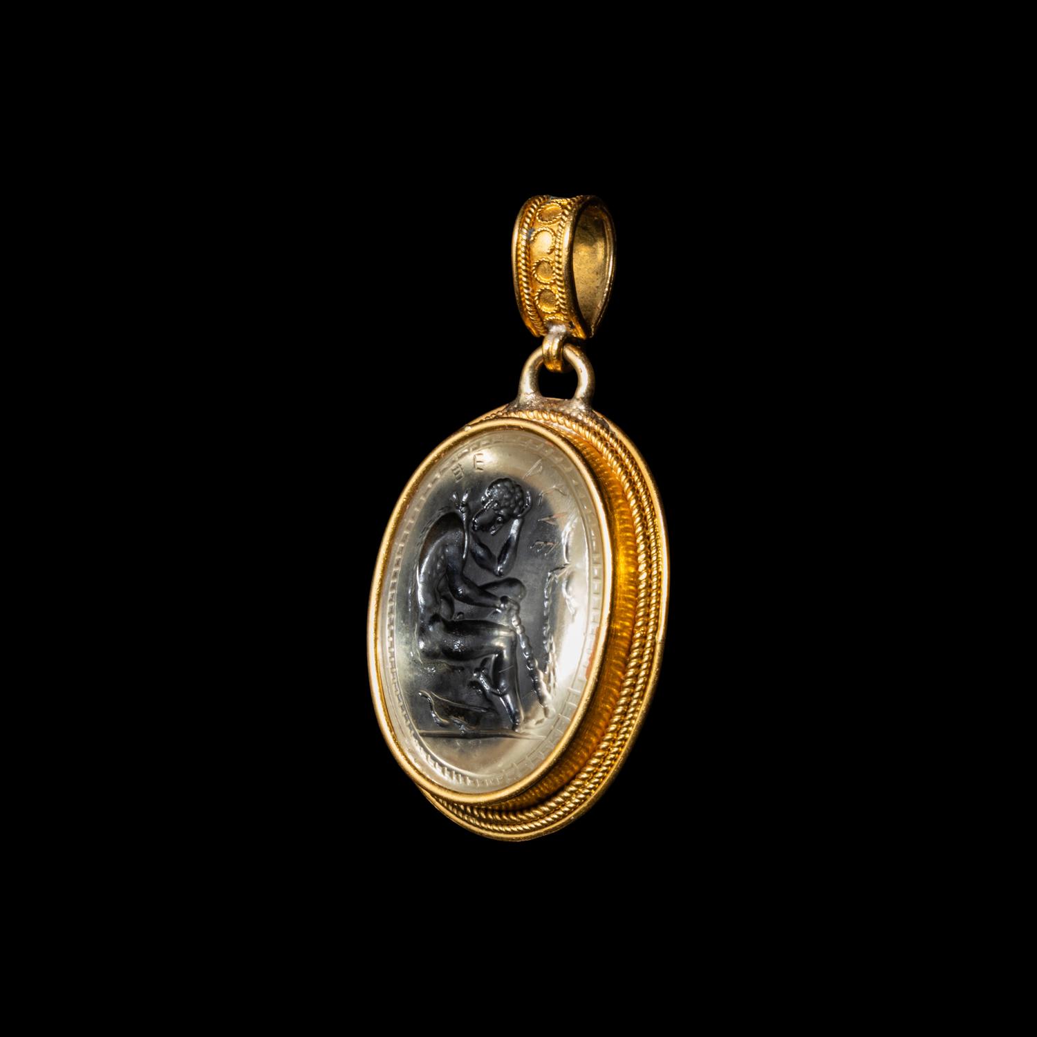 An Etruscan Revival Gold and Rock Crystal Pendant