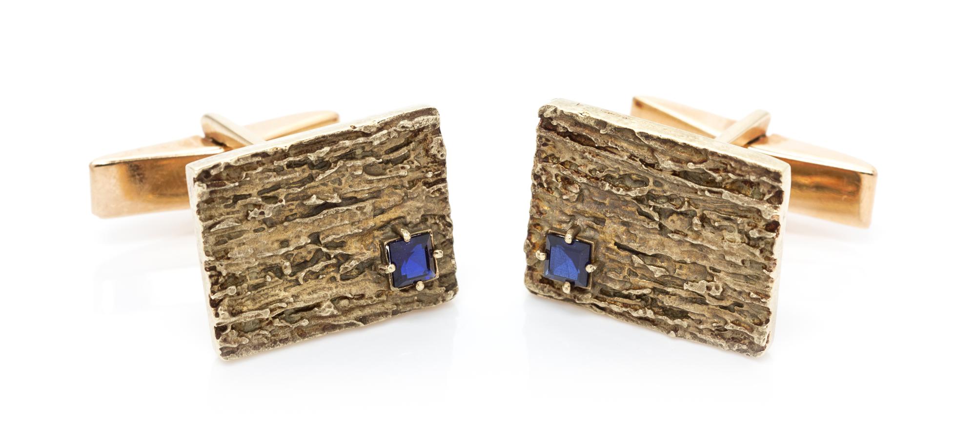 A Pair of 14 Karat Yellow Gold and Synthetic Sapphire Cufflinks, 7.30 dwts.