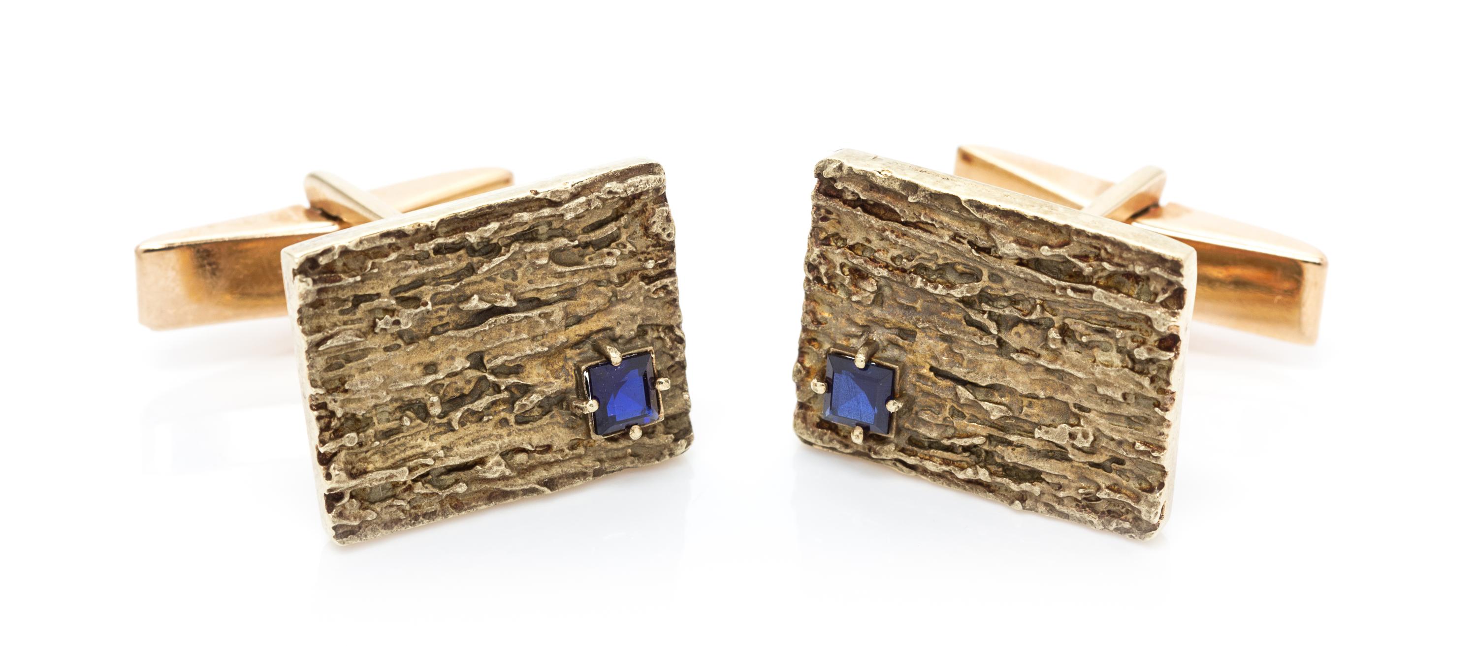 A Pair of 14 Karat Yellow Gold and Synthetic Sapphire Cufflinks, 7.30 dwts.