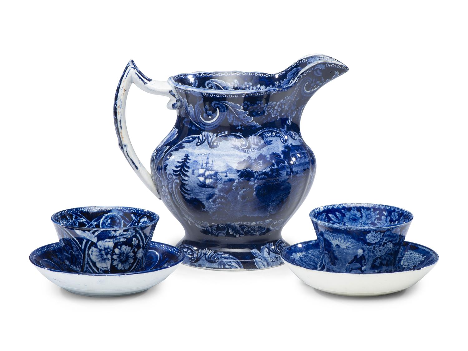 A Historical Blue Staffordshire Pitcher and Two Cups with Saucers