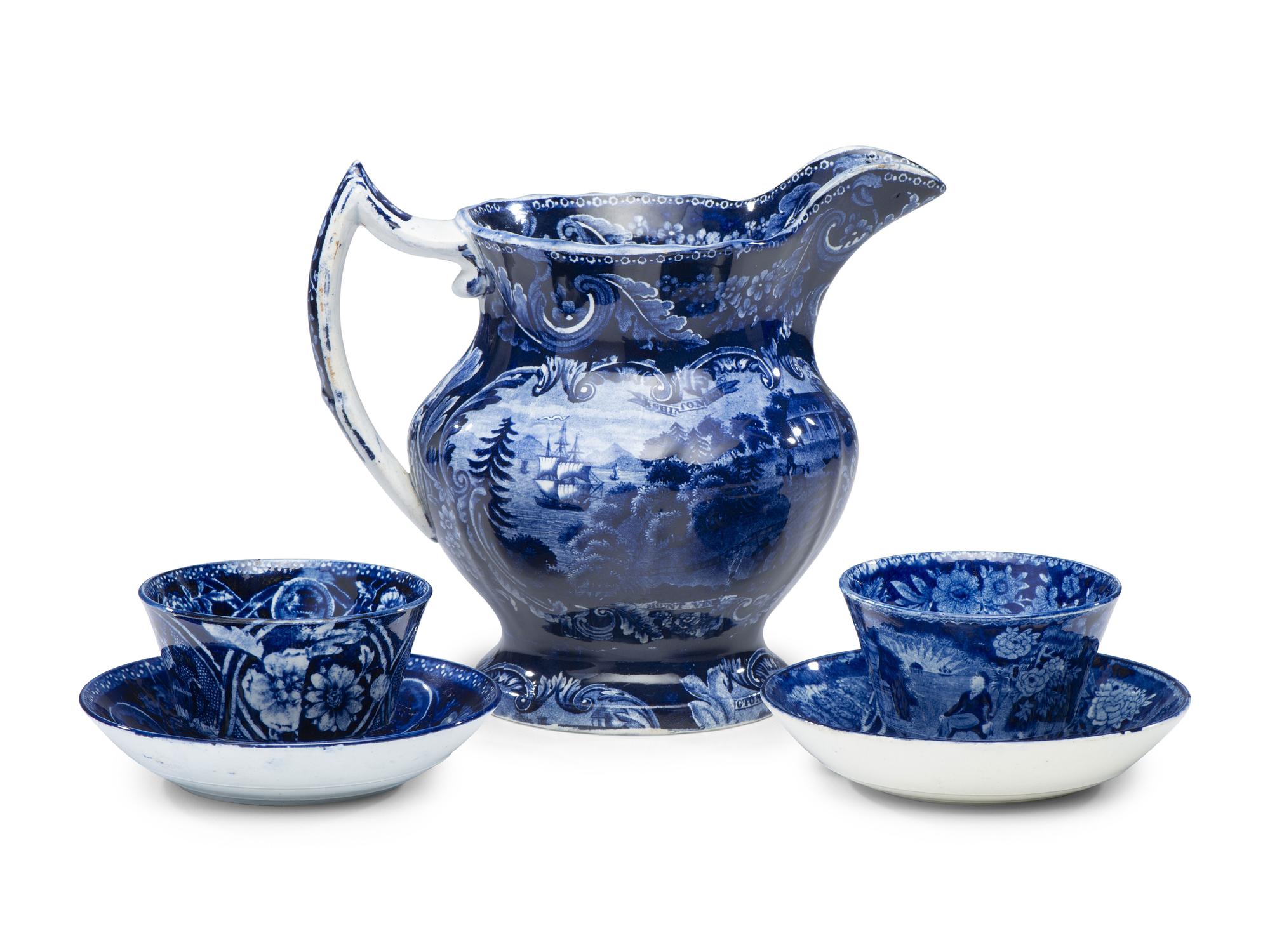 A Historical Blue Staffordshire Pitcher and Two Cups with Saucers