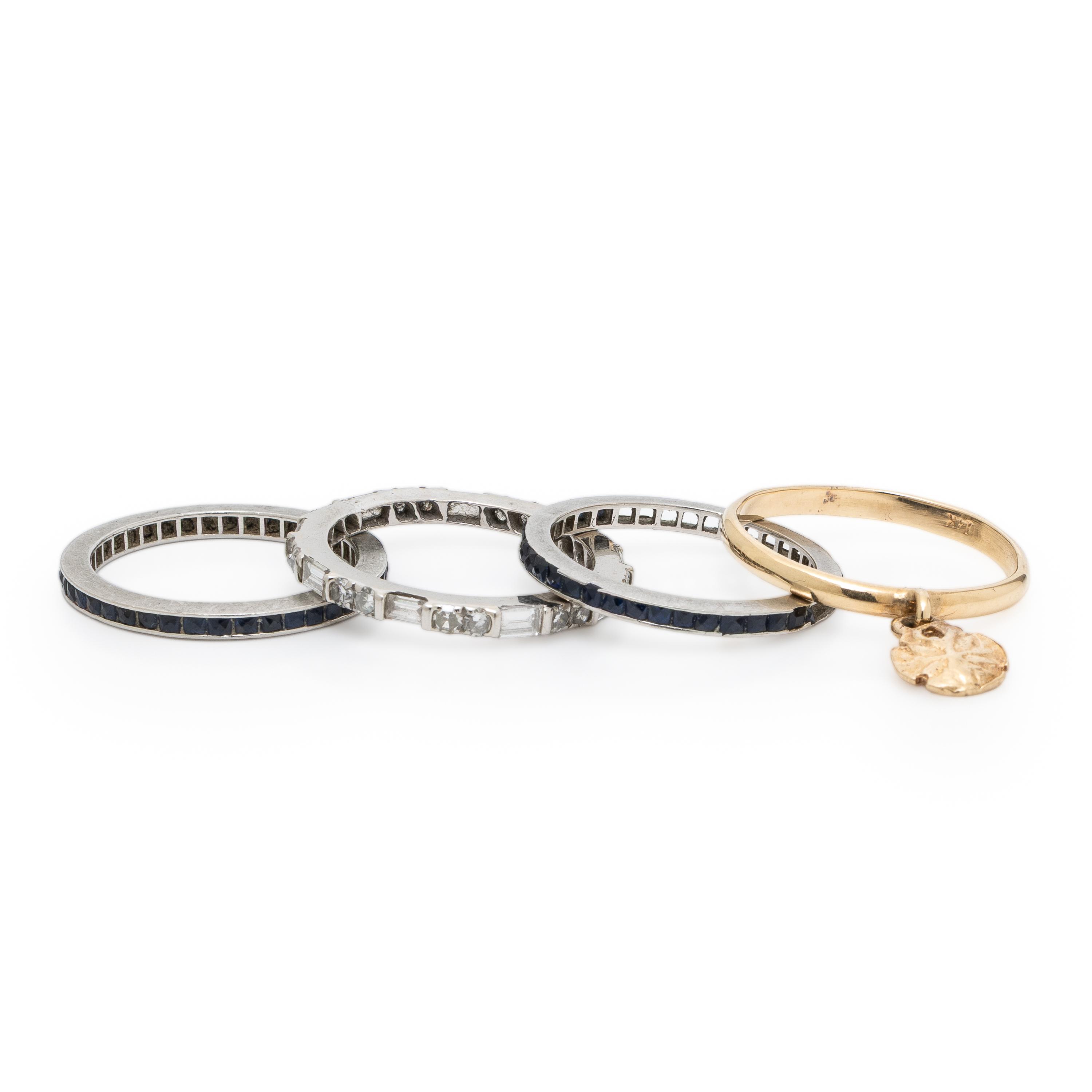 Collection of Three Platinum Eternity Bands and a Yellow Gold Ring